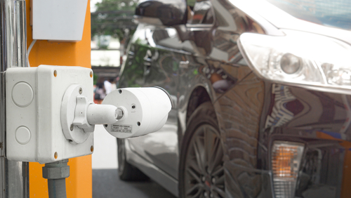 Security,Equipment,Concept,-,Cctv,Camera,Surveillance,On,Car,Parking